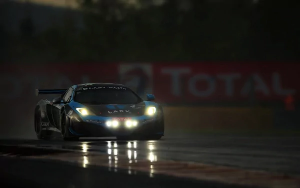 HD PC desktop wallpaper featuring a McLaren MP4-12C GT3 racing car with headlights on, driving on a wet track at dusk.