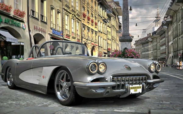 Silver classic Chevrolet Corvette convertible parked on a cobblestone European street — 4K Ultra HD PC desktop wallpaper and background with crisp reflections and moody sky.