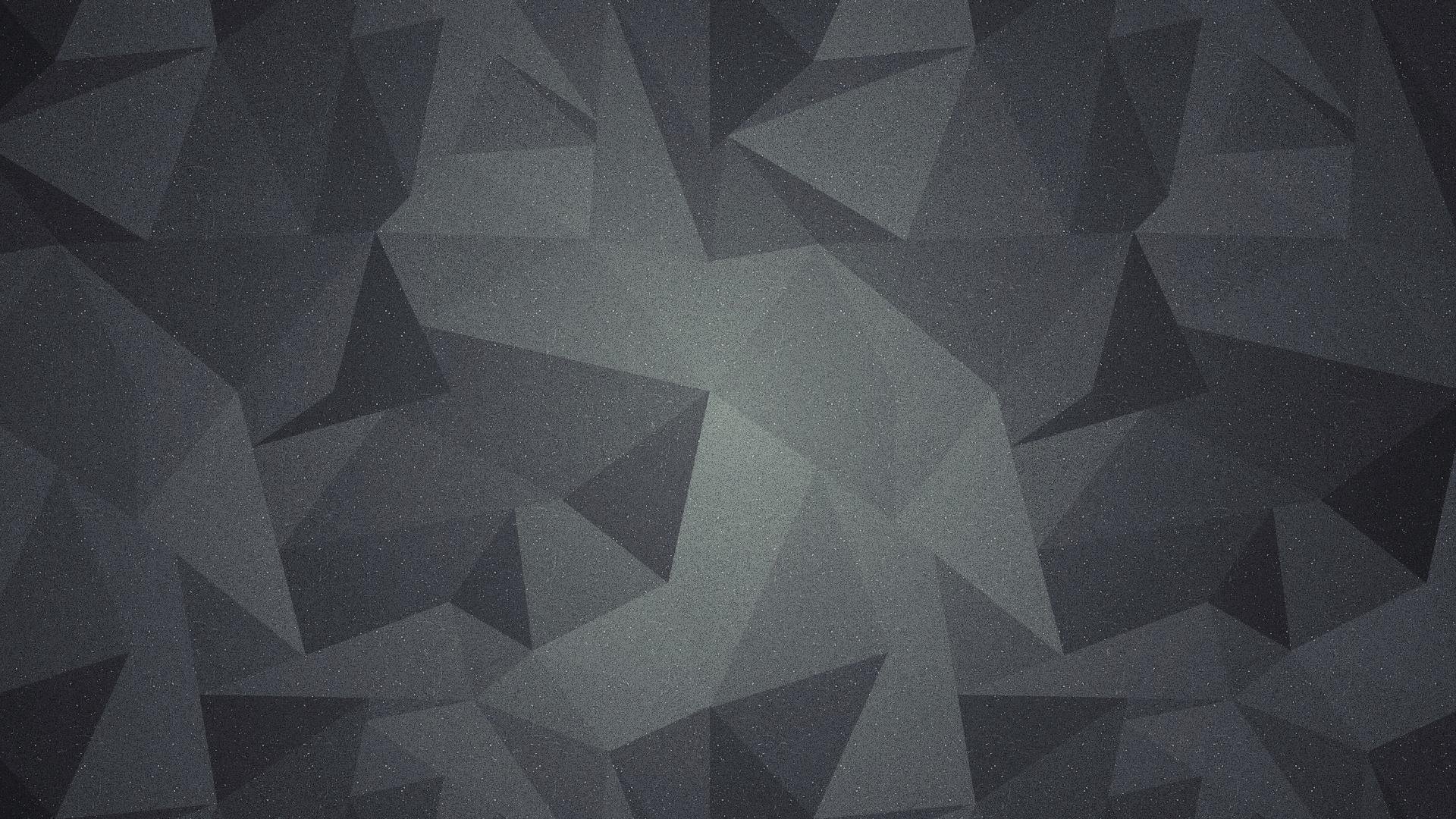 Abstract artistic HD PC desktop wallpaper: dark low-poly geometric pattern with subtle gradient and textured grain, creating a modern background.