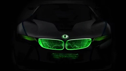 A striking HD desktop wallpaper featuring a sleek black car with vibrant green lights, showcasing a fusion of technology and modern design, tagged with Alienware.