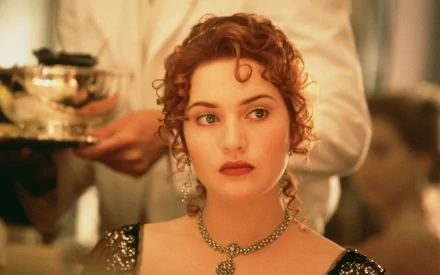 HD desktop wallpaper of Kate Winslet as Rose from the movie Titanic, featuring a close-up of her in an elegant evening dress with a serene expression.
