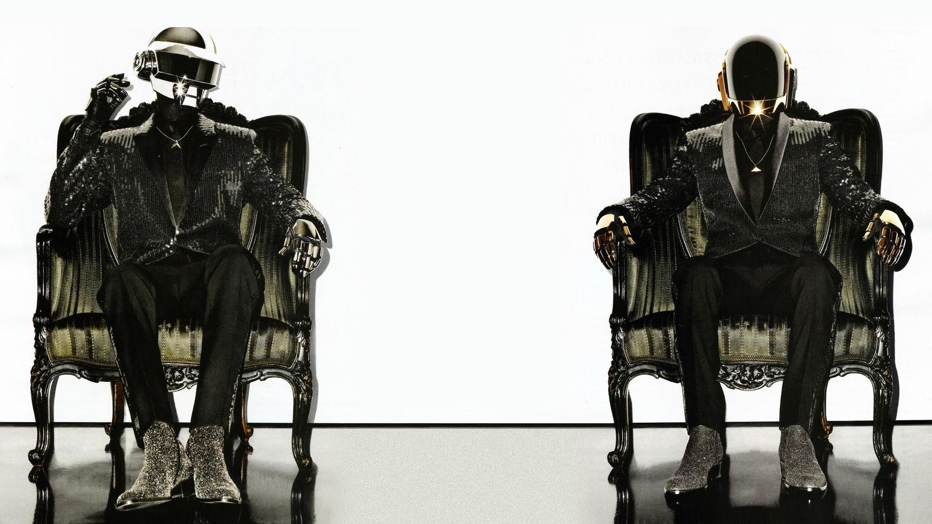 HD PC desktop wallpaper showing two helmeted electronic music performers in tuxedos seated on ornate chairs against a stark white background.