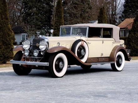 A cream and brown 1930 Cadillac Phaeton V16 classic car parked outdoors, featured as an HD PC desktop wallpaper and background.