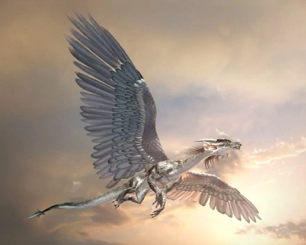 A majestic dragon with expansive wings soars through a dramatic sky, capturing the essence of fantasy in this stunning HD PC desktop wallpaper and background.
