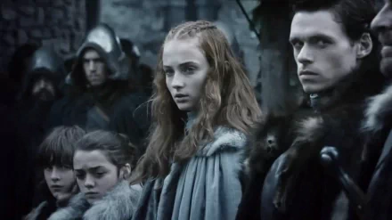 A gripping scene from *Game of Thrones*, featuring Richard Madden as Robb Stark, Maisie Williams as Arya Stark, and Sophie Turner as Sansa Stark, captured in a dramatic moment.