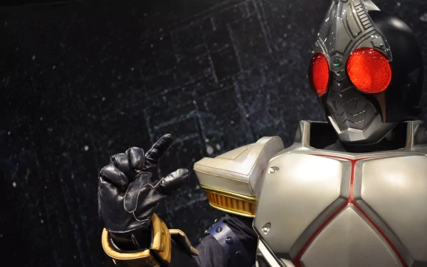 A close-up of a Kamen Rider character in a detailed suit, featuring striking red eyes and a dark backdrop, designed as a high-definition PC desktop wallpaper.