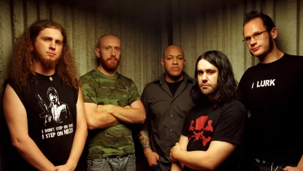 A high-definition wallpaper featuring the band Killswitch Engage, showcasing the five members standing confidently together in a dimly lit setting.