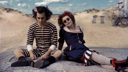 A striking HD wallpaper featuring Johnny Depp and Helena Bonham Carter in their roles from Sweeney Todd: The Demon Barber of Fleet Street in Concert, set against a whimsical backdrop.