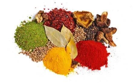 Colorful herbs and spices arranged on a white background, captured in HD for a vibrant PC desktop wallpaper and background.