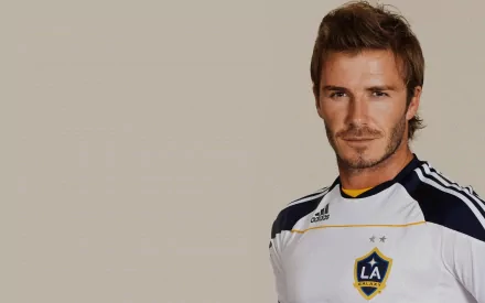 David Beckham in an LA Galaxy jersey, exuding confidence and charisma. A high-definition desktop wallpaper capturing his iconic sports presence.