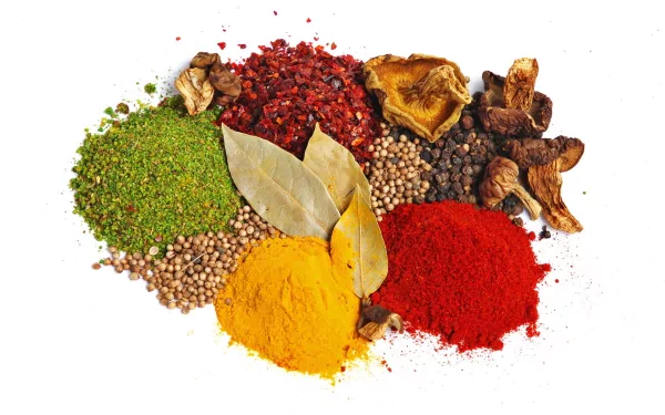 Colorful herbs and spices arranged on a white background, captured in HD for a vibrant PC desktop wallpaper and background.