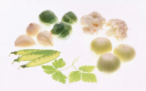 HD PC desktop wallpaper featuring an assortment of vegetables including Brussels sprouts, garlic, cauliflower, peas, onions, and cilantro on a white background.