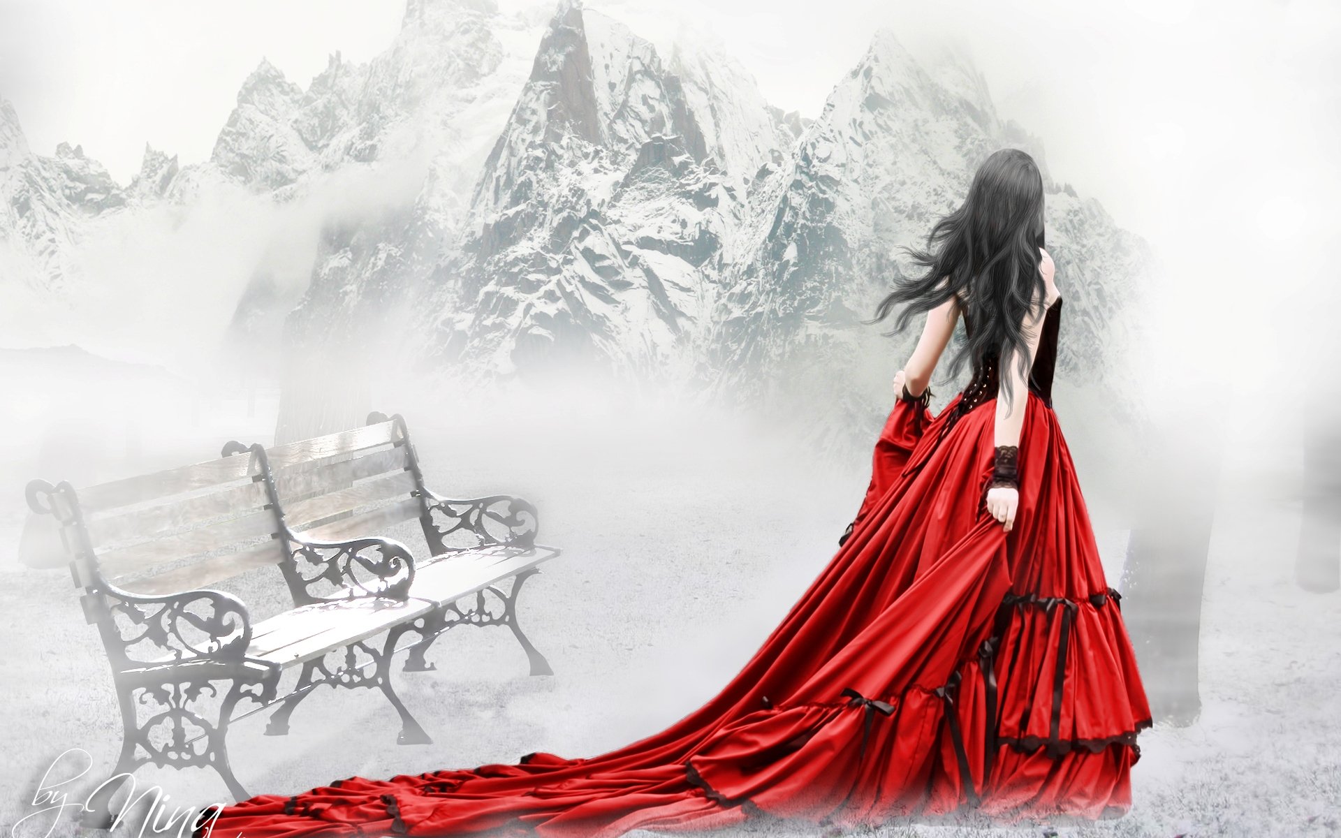 A woman in a flowing red gown stands against a misty mountain backdrop, conveying an artistic ambiance. This HD desktop wallpaper adds a striking visual element to any background.