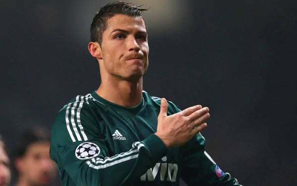 HD desktop wallpaper featuring Cristiano Ronaldo in a Real Madrid C.F. jersey, expressing emotion during a sports event.