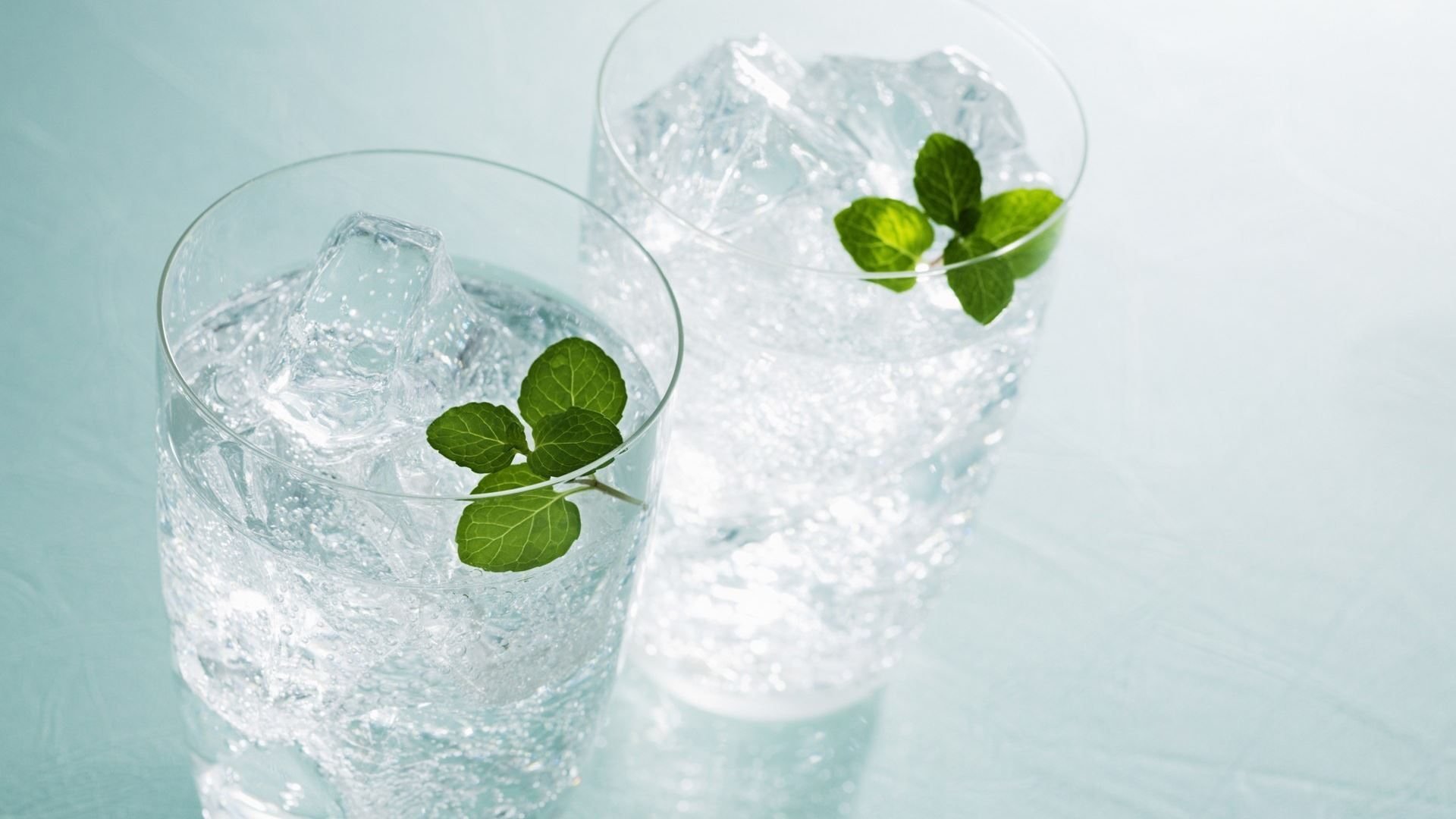 HD PC desktop wallpaper featuring two glasses of iced water garnished with fresh mint leaves, highlighting food and drink elements in a crisp, refreshing setting.