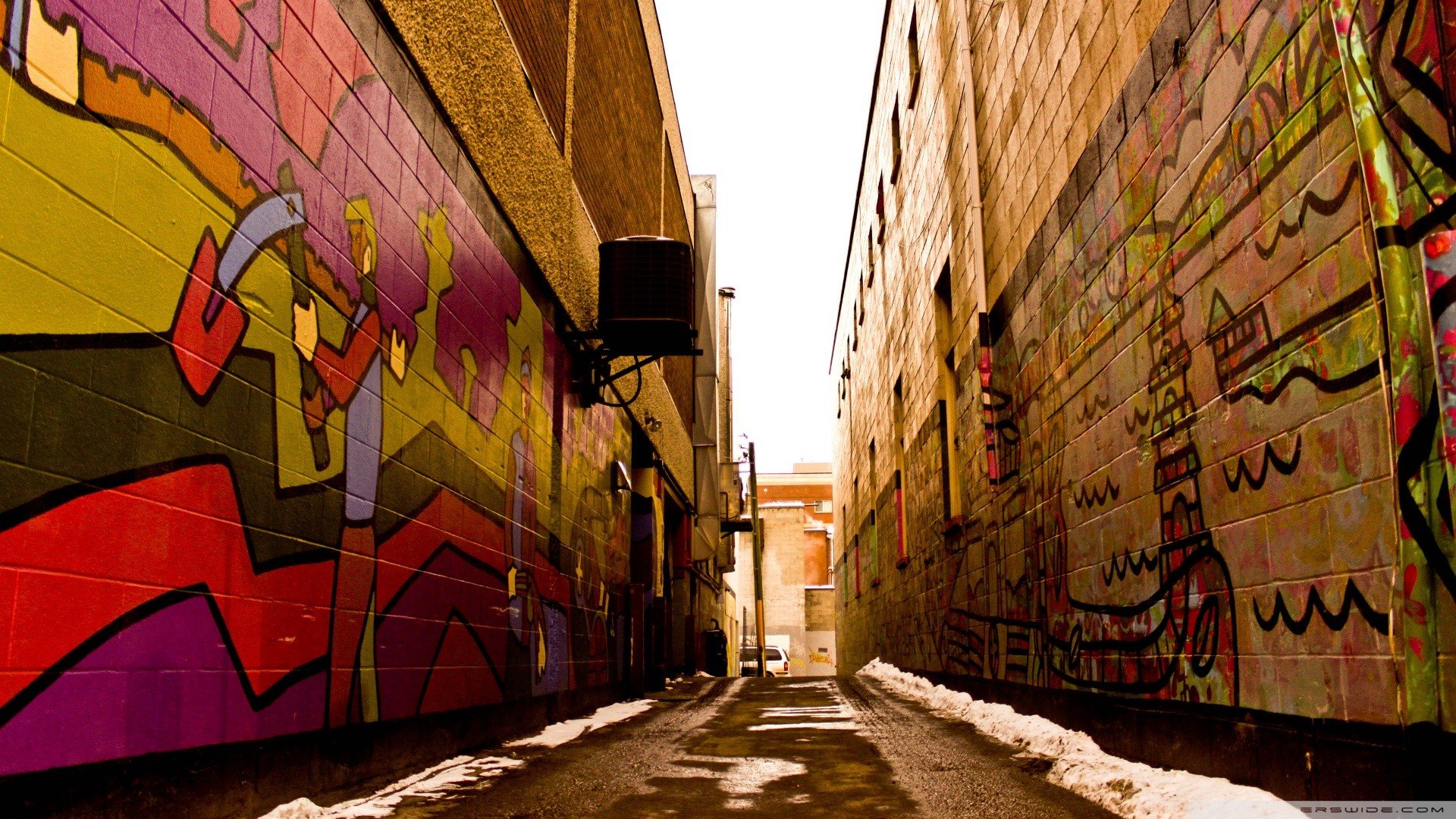 HD desktop wallpaper featuring a narrow man-made alley with colorful graffiti art on brick walls under natural lighting.