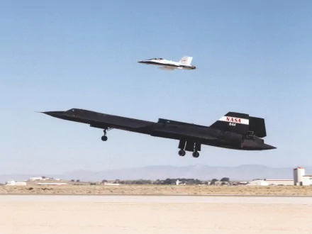 HD desktop wallpaper featuring a Lockheed SR-71 Blackbird military aircraft taking off with another jet flying above against a clear sky backdrop.