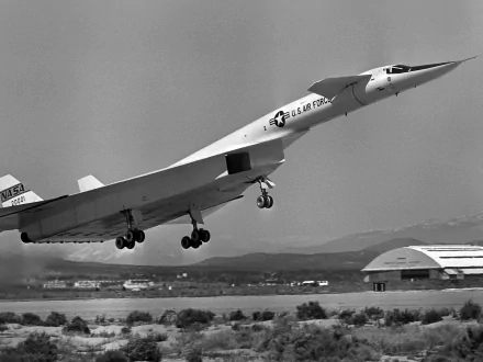 Black-and-white military North American XB-70 Valkyrie taking off over a runway — 2K Quad HD PC desktop wallpaper and background image.