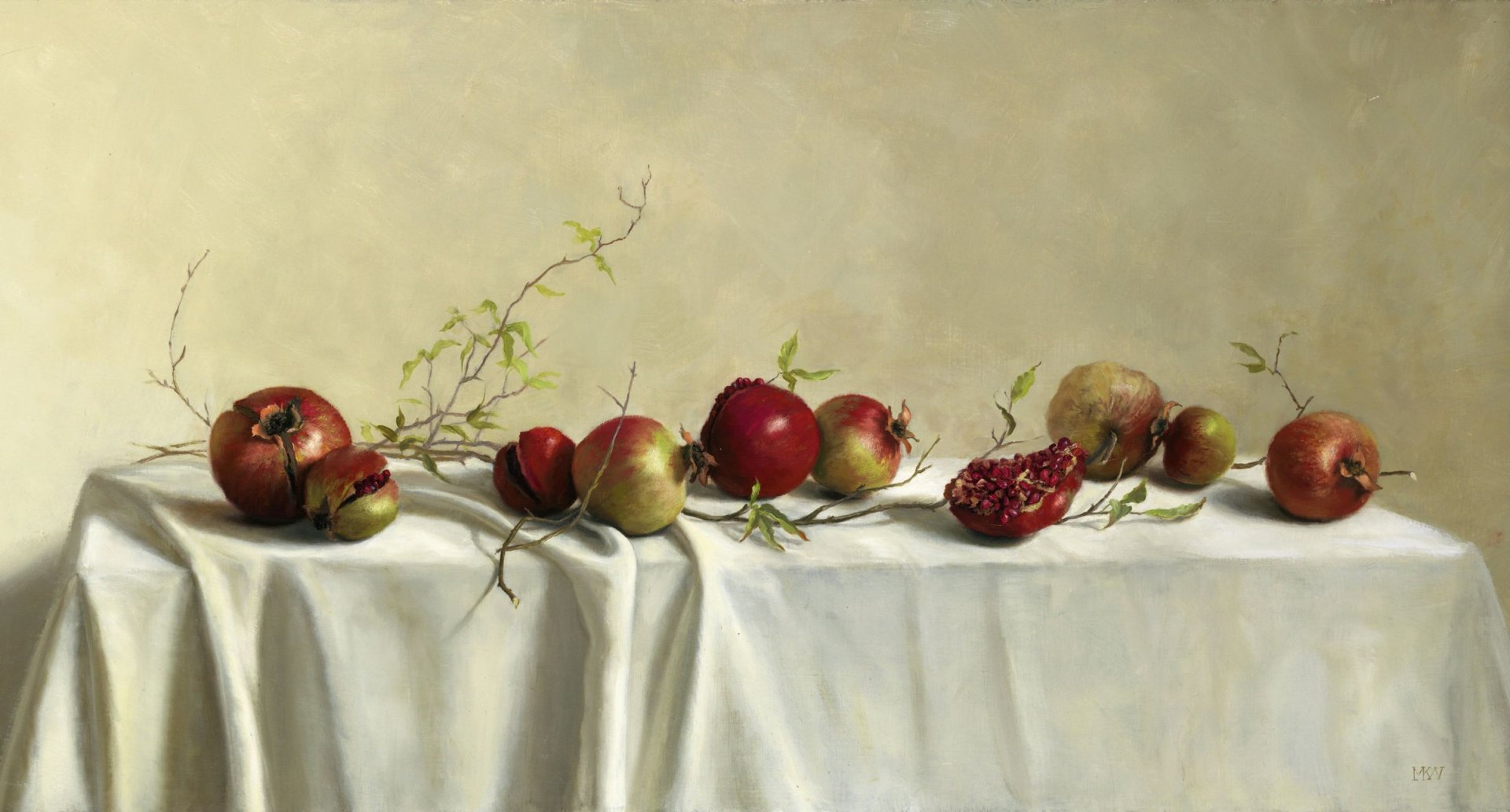 HD desktop wallpaper featuring a still life arrangement of pomegranates and branches on a draped white cloth with a soft, muted background.