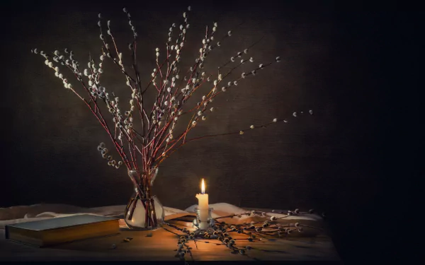 A serene still life featuring a lit candle beside a vase of branches, set against a dark background, creates a warm, inviting atmosphere for a HD desktop wallpaper.