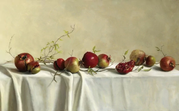 HD desktop wallpaper featuring a still life arrangement of pomegranates and branches on a draped white cloth with a soft, muted background.