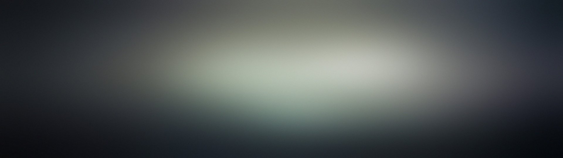 Artistic black gradient HD PC desktop wallpaper featuring smooth transitions from dark to light tones, creating a minimalist and elegant background.