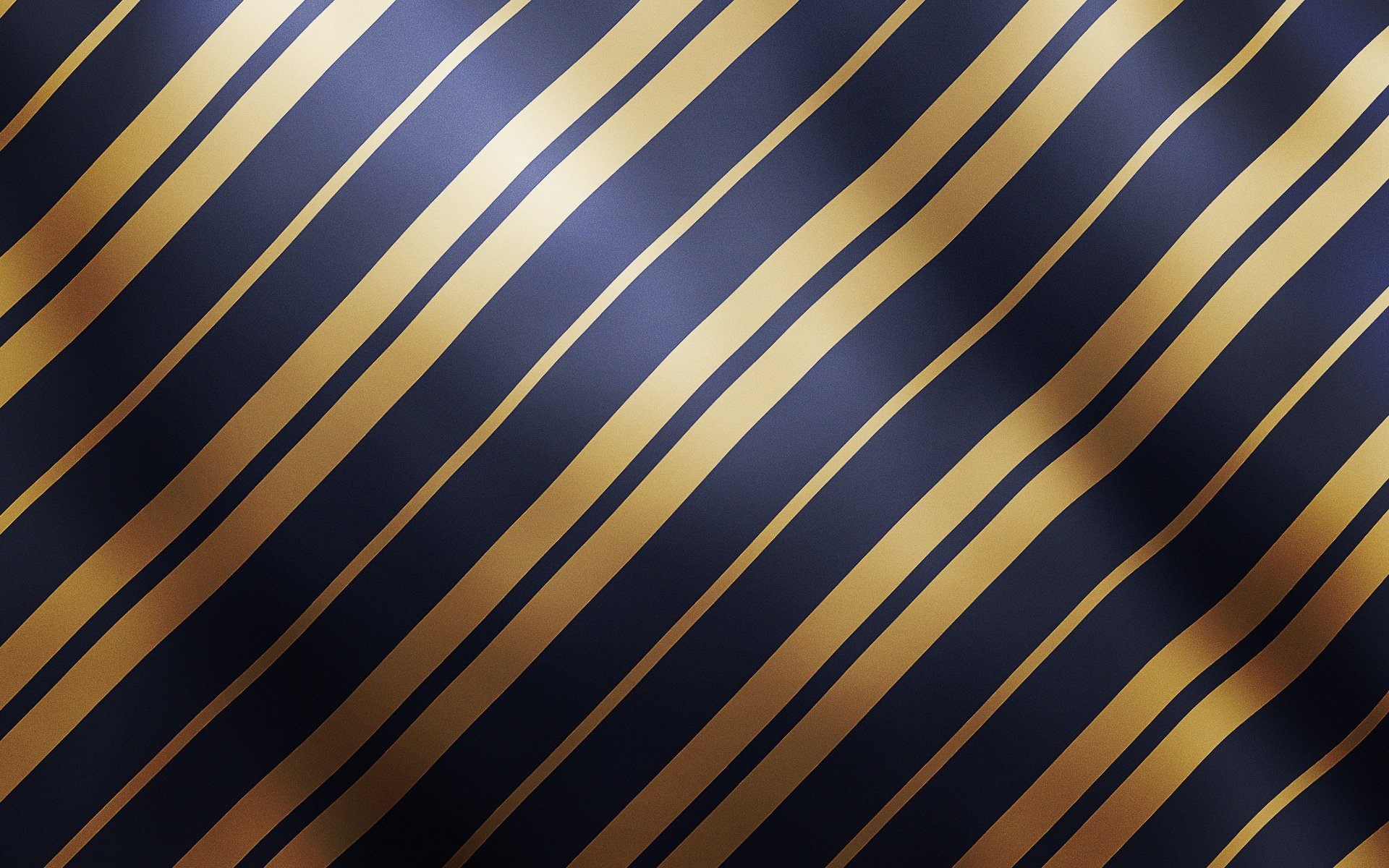 HD PC desktop wallpaper featuring an abstract design of smooth, wavy gold lines on a dark blue background, creating a modern and sleek visual effect.