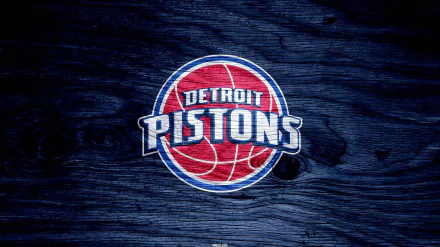 HD desktop wallpaper featuring the Detroit Pistons logo on a textured dark wooden background, representing the basketball team and sports spirit.