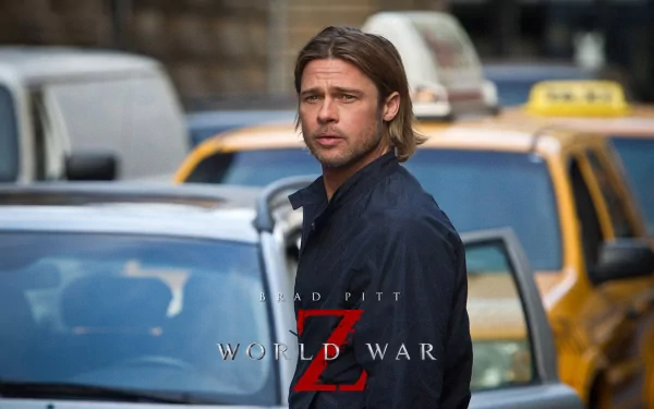 HD PC desktop wallpaper: close-up of the male lead from the movie World War Z standing amid city traffic, cinematic and moody.