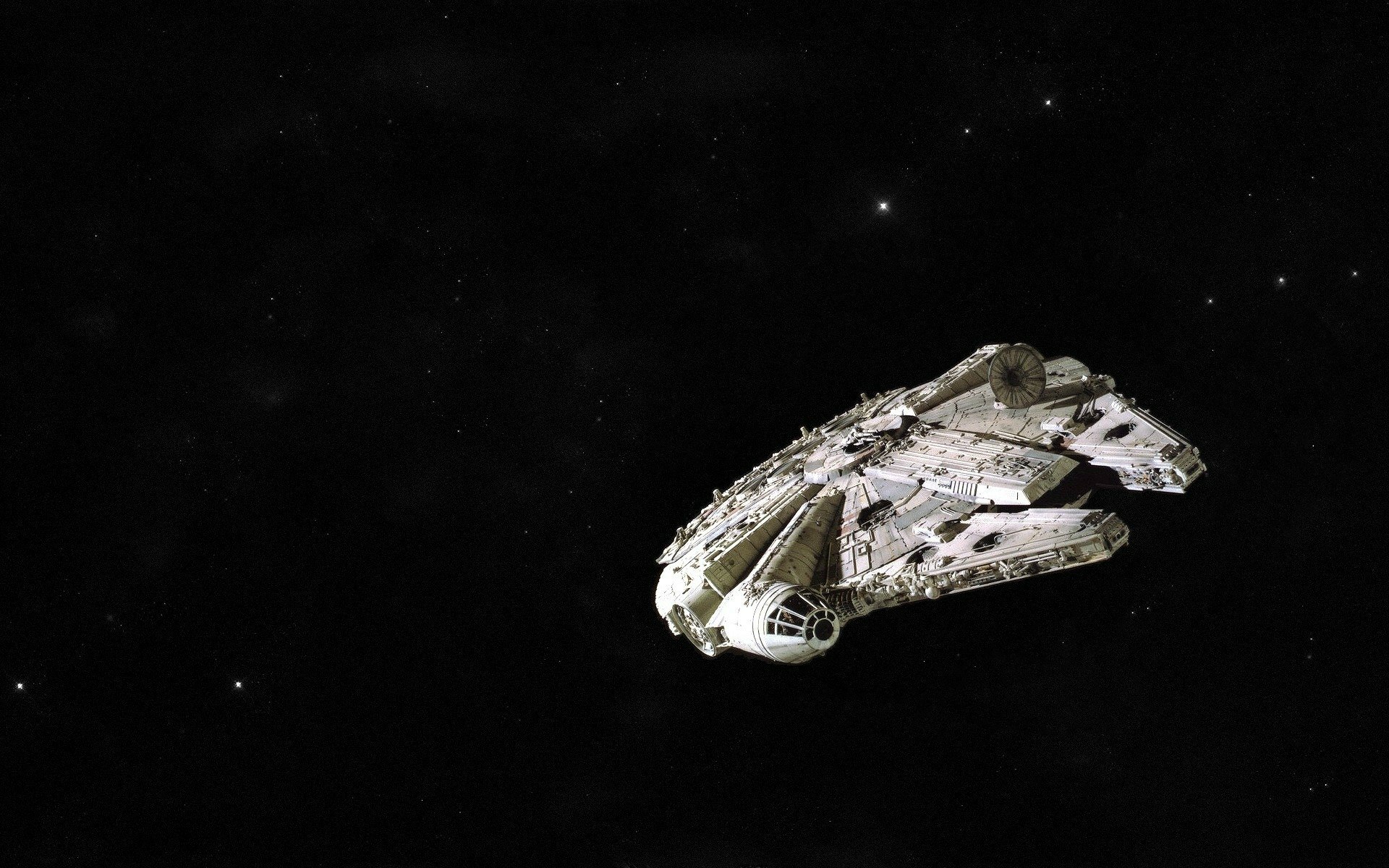 HD PC desktop wallpaper featuring the Millennium Falcon spaceship from the Star Wars movie, set against a starry black space background.