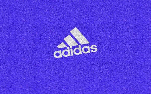 A vibrant HD desktop wallpaper featuring a striking purple background with the iconic Adidas logo prominently displayed in white.