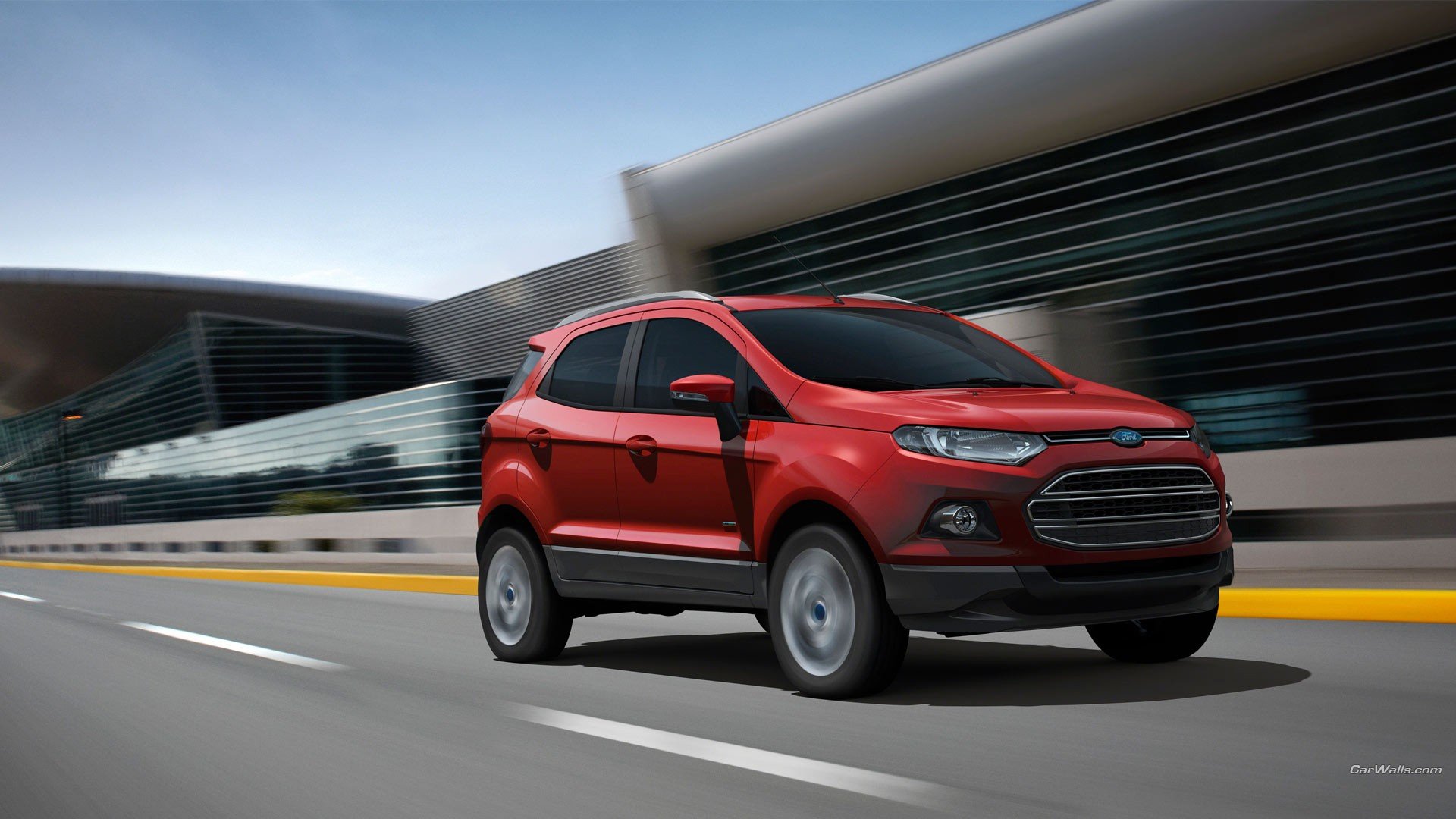 Red Ford EcoSport vehicle — compact SUV driving on an urban road, dynamic HD PC desktop wallpaper background.