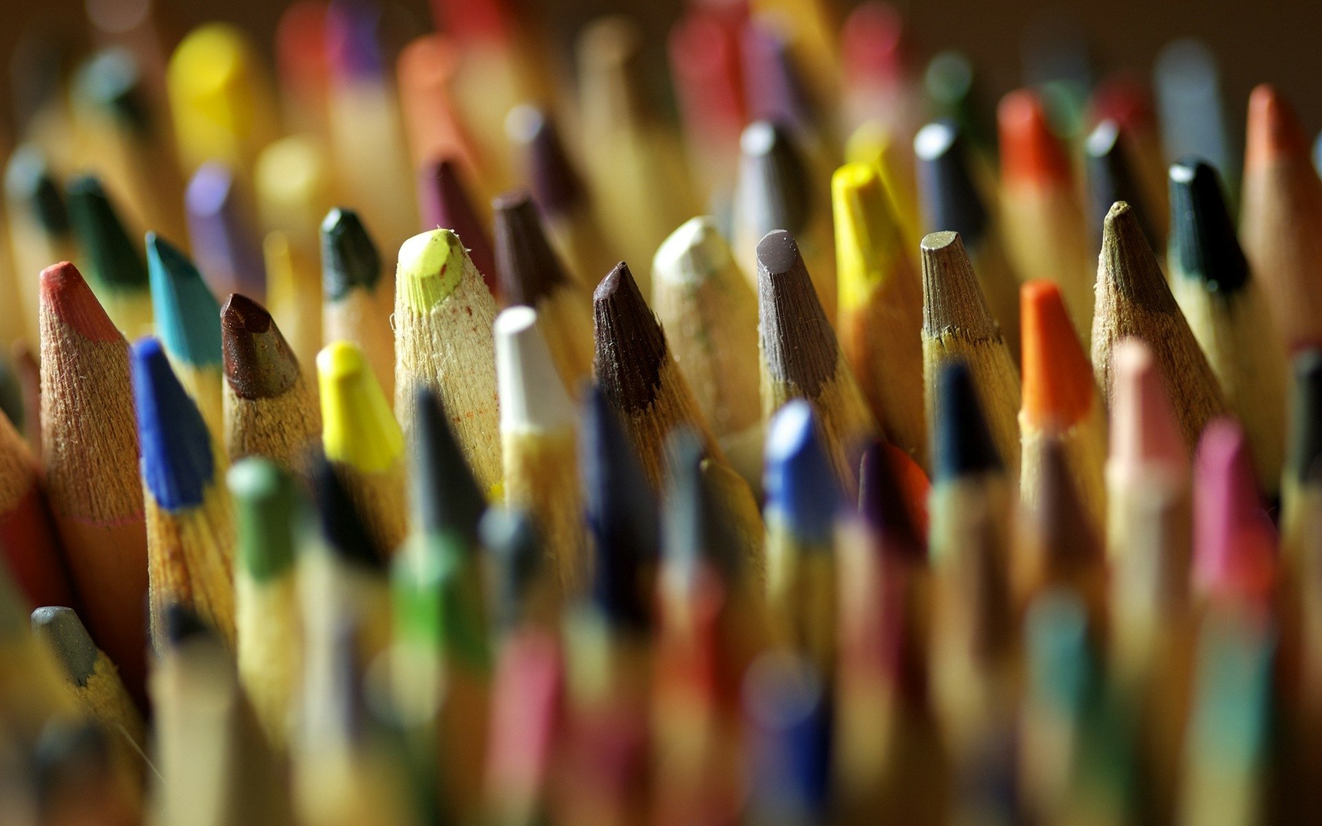 Close-up photography of colorful pencil tips captured in high definition, used as a vibrant PC desktop wallpaper and background.