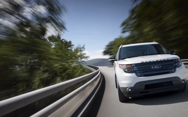 White Ford Explorer Sport vehicle driving on a curving road with motion blur, HD PC desktop wallpaper and background.