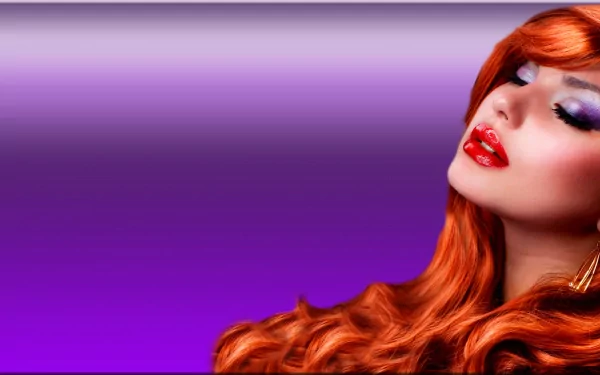 HD desktop wallpaper featuring a glamorous redhead woman model with striking makeup, set against a soft purple background.