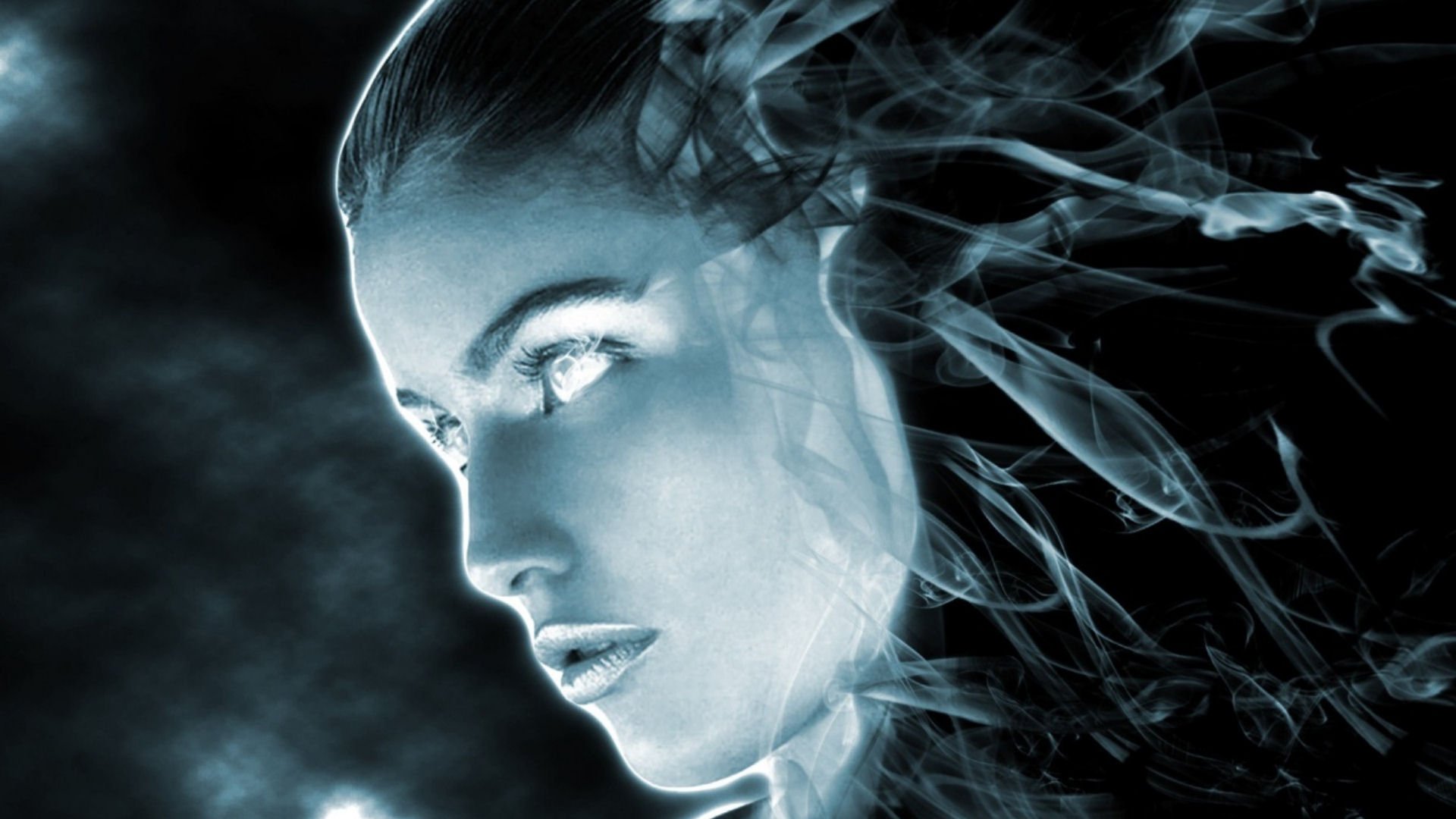 HD fantasy desktop wallpaper featuring a woman’s ethereal face blending with swirling smoke and shadows, creating a mysterious and otherworldly atmosphere.