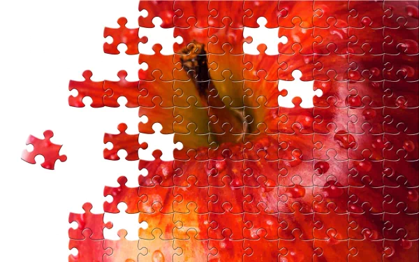 HD desktop wallpaper featuring a jigsaw puzzle with a partial apple image, with one piece detached.