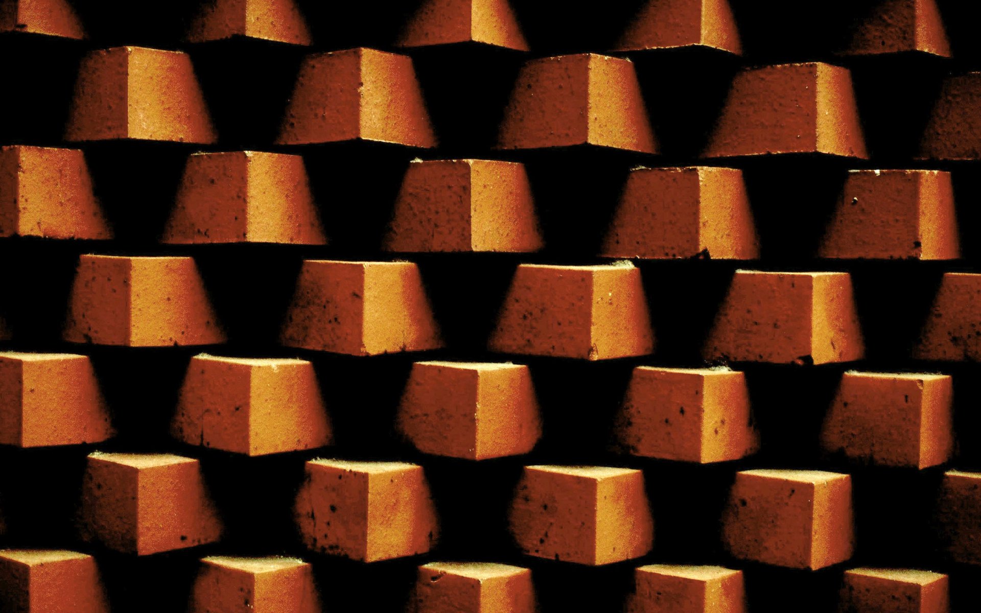 HD photography of stacked orange bricks showcasing texture and shadow, designed as a PC desktop wallpaper and background.