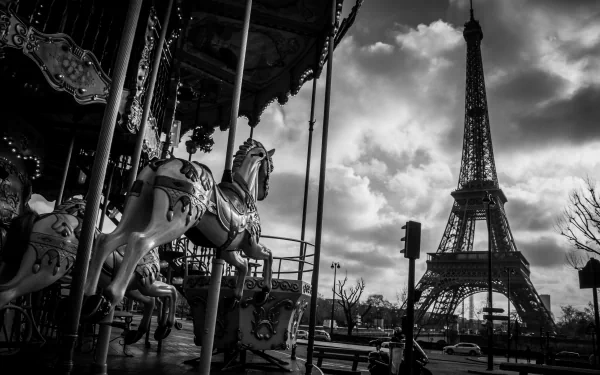 A black and white image of a carousel horse in Paris, with the Eiffel Tower looming in the background, captured in stunning 4K Ultra HD detail.