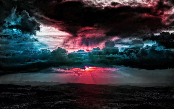 A dramatic sky filled with colorful clouds and rays of sunlight emerging from behind, capturing the beauty of nature in a striking HD desktop wallpaper.