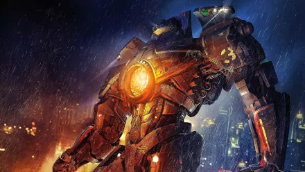 A dynamic HD wallpaper featuring a giant robot from the movie Pacific Rim, set against a dramatic backdrop of rain and fire, showcasing its powerful design and glowing core.