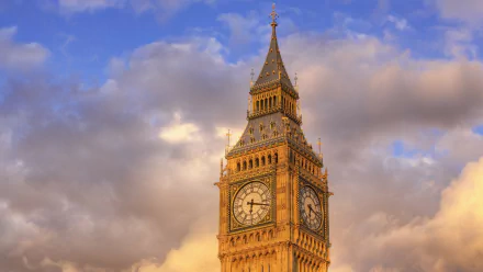 A stunning HD wallpaper featuring Big Ben against a backdrop of blue skies and fluffy clouds, highlighting London's iconic clock tower in all its architectural glory.