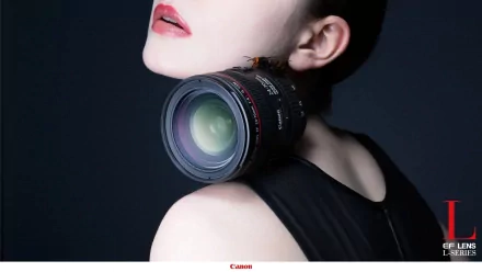 A striking HD wallpaper featuring a close-up of a woman's neck and shoulder, adorned with a Canon camera lens, blending elements of fashion and photography artistry.