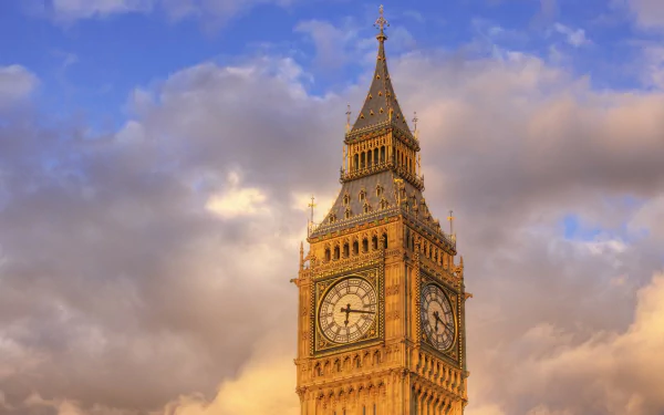 A stunning HD wallpaper featuring Big Ben against a backdrop of blue skies and fluffy clouds, highlighting London's iconic clock tower in all its architectural glory.