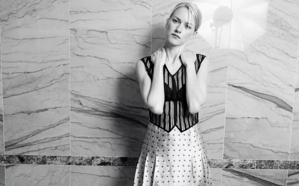 Black and white HD desktop wallpaper featuring celebrity Naomi Watts posing against a textured marble wall background.
