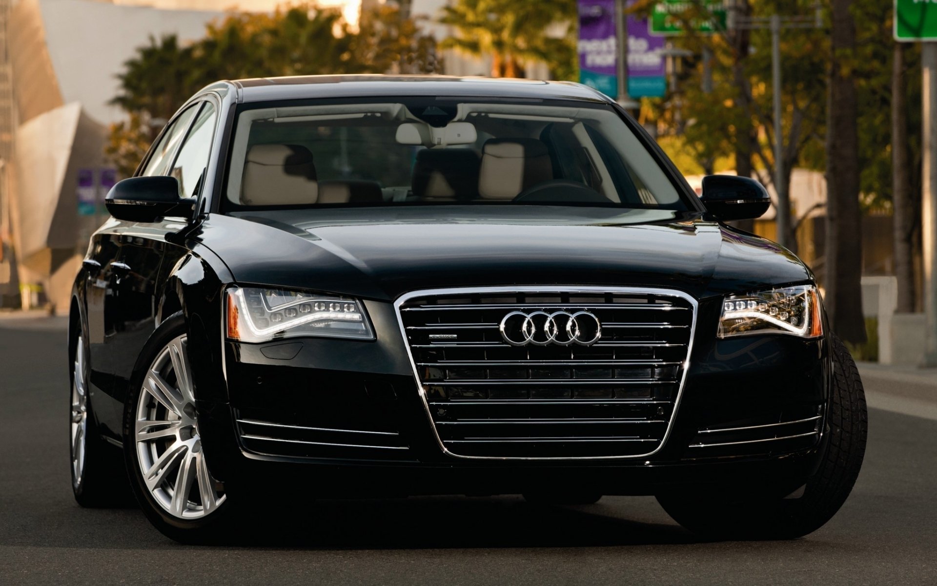 Front view of a black Audi sedan on a city street, high-resolution HD PC desktop wallpaper background.
