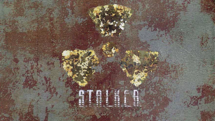 HD PC desktop wallpaper featuring a distressed radioactive hazard symbol and the S.T.A.L.K.E.R. video game title on a textured, weathered background.
