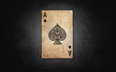 HD wallpaper of an Ace of Spades card on a dark textured background, portraying a vintage and man-made design.