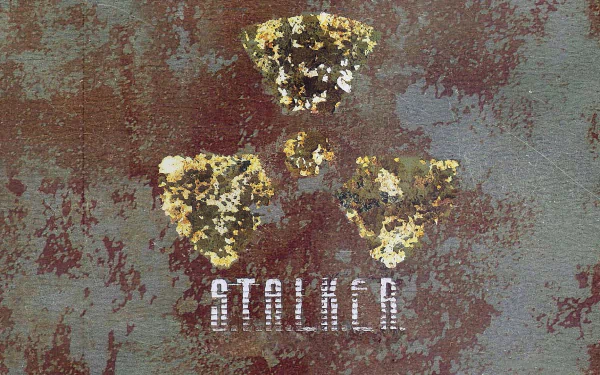 HD PC desktop wallpaper featuring a distressed radioactive hazard symbol and the S.T.A.L.K.E.R. video game title on a textured, weathered background.