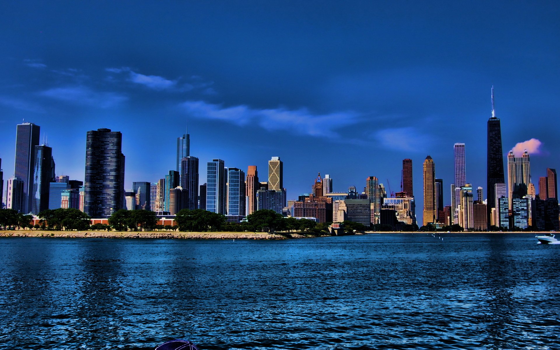 HD PC desktop wallpaper: Chicago's man-made skyline at dusk, glowing skyscrapers reflected on Lake Michigan.